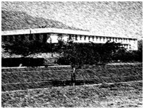 Historic photograph of a long college building
